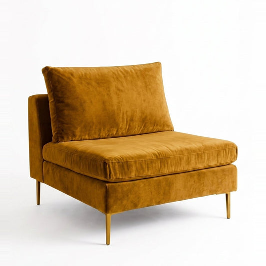 Sillón Edlyn de un cuerpo en color oro en pana antimanchas, sin apoyabrazos y con patas de aluminio dorado