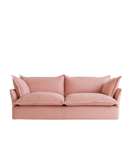 Sofá Comfy de Tienda de Banquitos en tono rosa, enfundado, con respaldo y apoyabrazos integrados, cojines extra mullidos, tapizado a medida