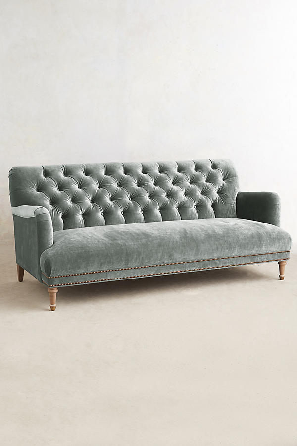 Sillón de tres cuerpos con capitoné gris