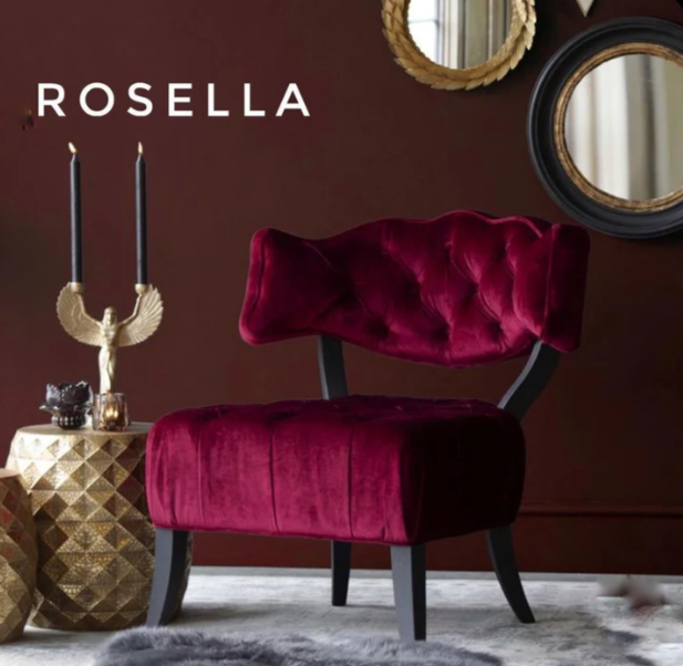 Butaca estilo capitoné en bordo con respaldo bajo y patas curvadas. Elegancia vintage para espacios infantiles o femeninos.