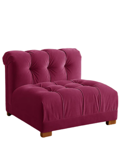 Butaca estilo matero tapizada en burdeos con capitoné en asiento y respaldo. Diseño bajo, mullido y confortable, ideal para niños o espacios de relax.