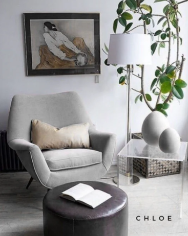 Sillón chloe gris de estilo escandinavo con patas de madera inclinadas. CyberMonday: hasta 6 cuotas sin interés y descuentos exclusivos.