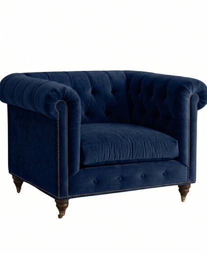 Sillón de un cuerpo Chesterfield color Azul en pana antimanchas importada, el clásico diseño inglés firme con detalle de tachas — el clásico de siempre para un living con personalidad. Hecho a medida por Tienda de Banquitos.