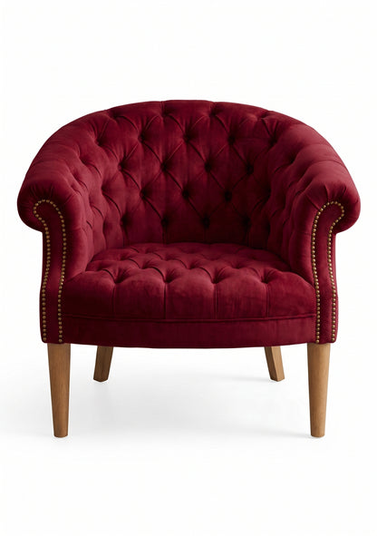 Sillón Nairobi de un cuerpo tapizado en bordo, capitoné redondeado con tachas y patas de madera – Tienda de Banquitos