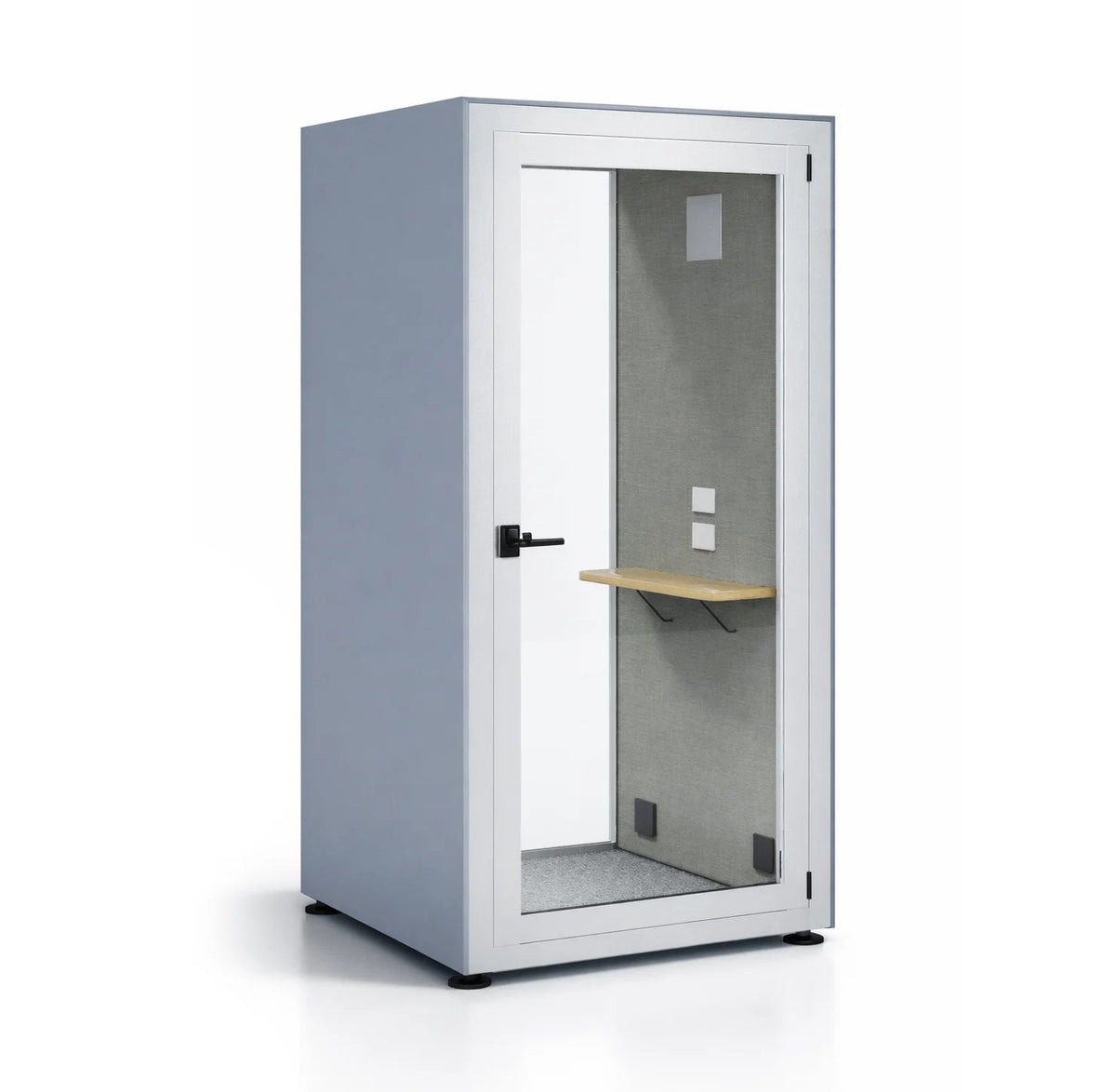 Cabina acústica Prisma S de Archivos Activos, exterior gris azulado con marco blanco, puerta de vidrio y mesa interior