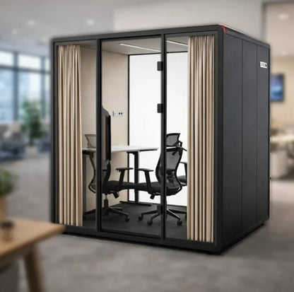 Cabina Domo Meeting de Archivos Activos negra, con mesa y sillas para reuniones dentro de la oficina