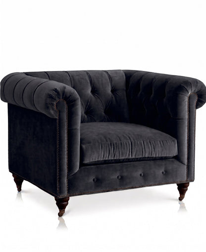 Sillón de un cuerpo Chesterfield color Grafito en pana antimanchas importada, el clásico diseño inglés firme con detalle de tachas — para un living con carácter que dure toda la vida. Hecho a medida por Tienda de Banquitos.