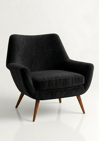 Sillón de un cuerpo Chloe color Black en pana antimanchas importada, respaldo curvo envolvente y patas de madera inclinadas de aire retro — ideal para sumar onda vintage al living. Hecho a medida por Tienda de Banquitos.