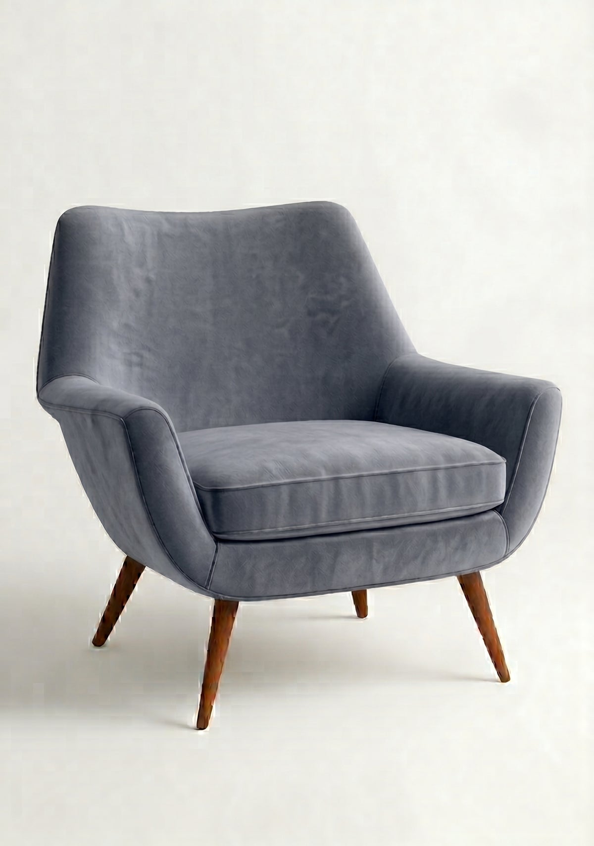 Sillón de un cuerpo Chloe color Onyx en pana antimanchas importada, respaldo curvo envolvente y patas de madera inclinadas de aire retro — ideal para sumar onda vintage al living. Hecho a medida por Tienda de Banquitos.