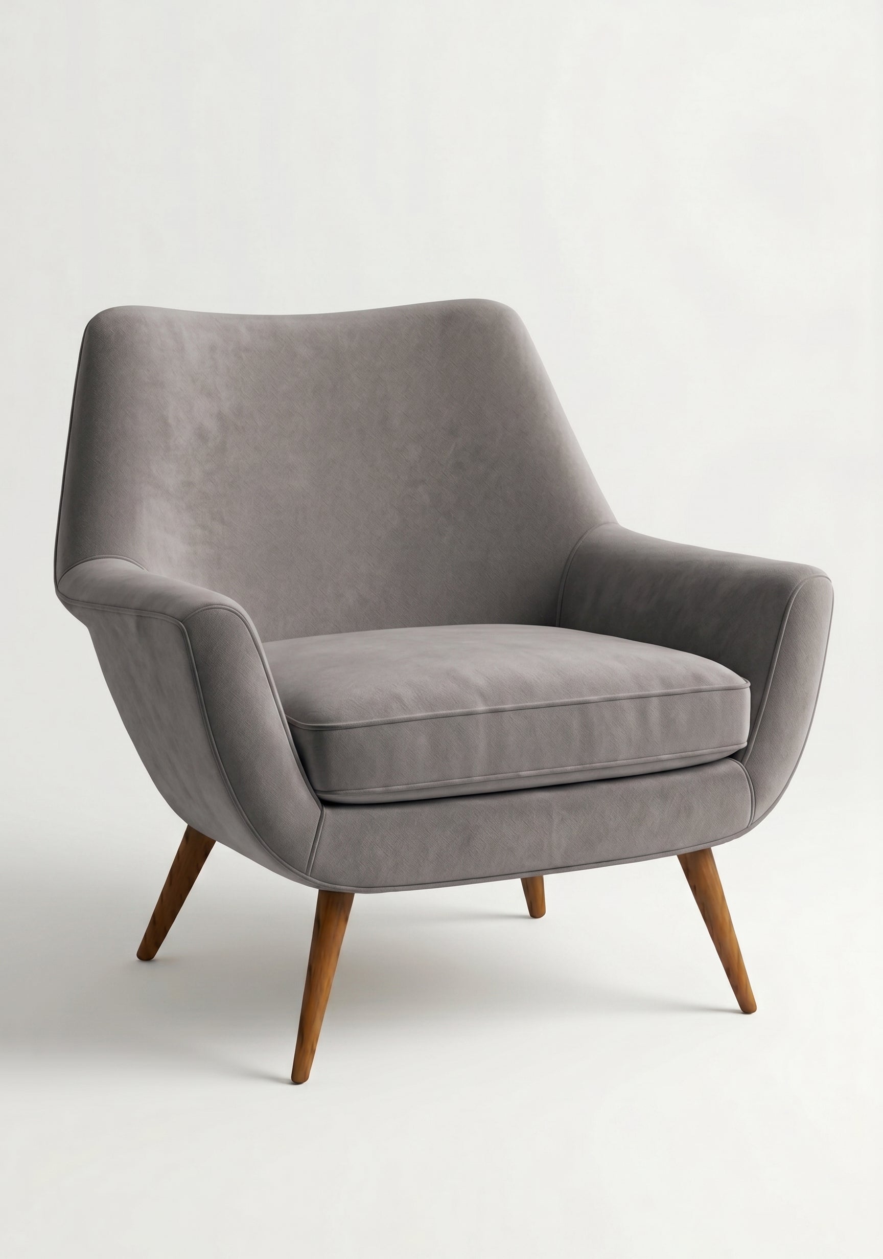 Sillón de un cuerpo Chloe color Plata en pana antimanchas importada, respaldo curvo envolvente y patas de madera inclinadas de aire retro — ideal para sumar onda vintage al living. Hecho a medida por Tienda de Banquitos.