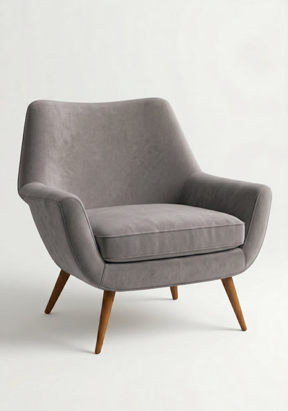Sillón de un cuerpo Chloe color Plata en pana antimanchas importada, respaldo curvo envolvente y patas de madera inclinadas de aire retro — ideal para sumar onda vintage al living. Hecho a medida por Tienda de Banquitos.
