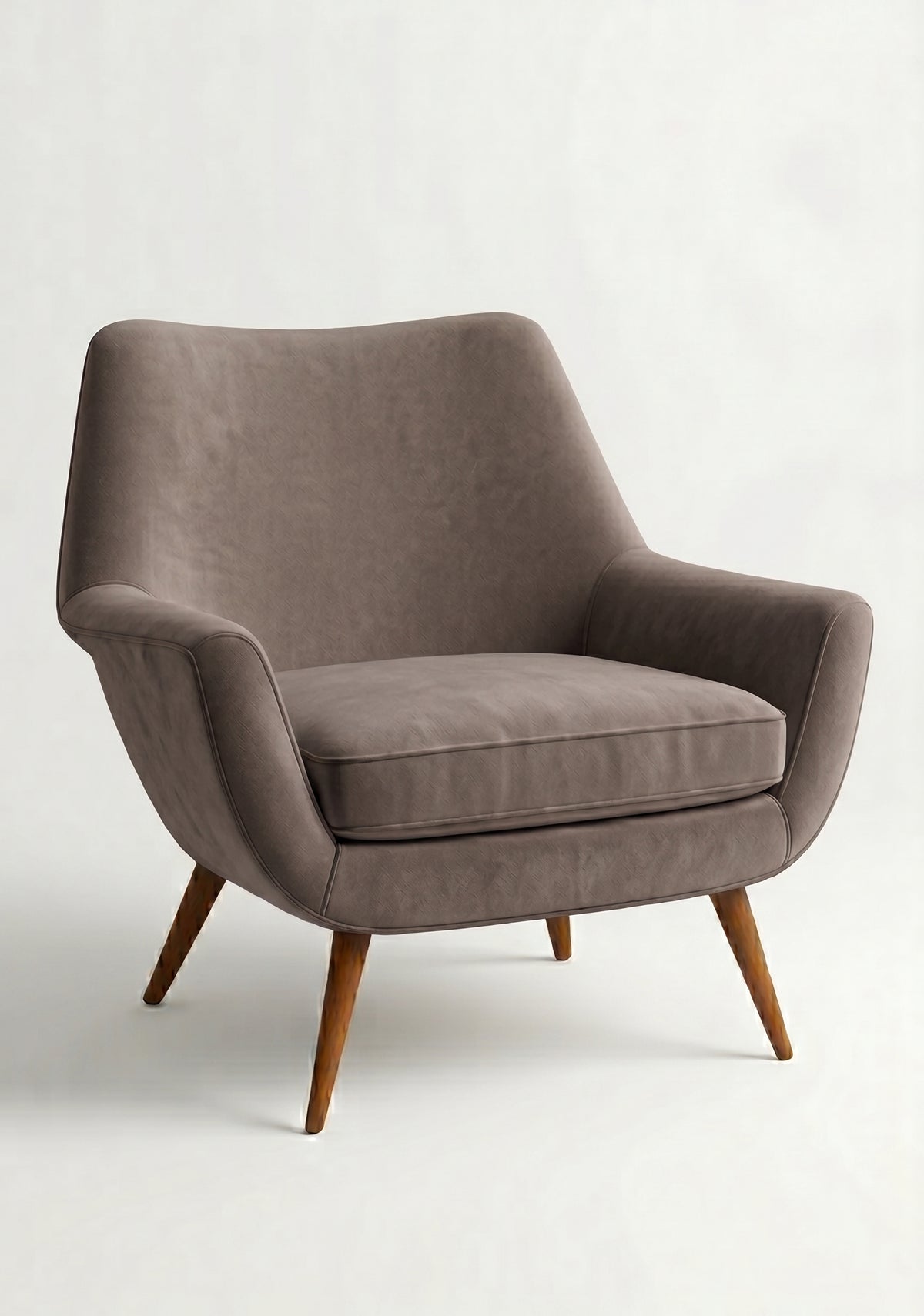 Sillón de un cuerpo Chloe color Stone en pana antimanchas importada, respaldo curvo envolvente y patas de madera inclinadas de aire retro — ideal para sumar onda vintage al living. Hecho a medida por Tienda de Banquitos.
