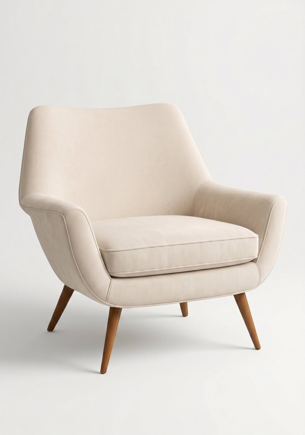 Sillón de un cuerpo Chloe color Vainilla en pana antimanchas importada, respaldo curvo envolvente y patas de madera inclinadas de aire retro — ideal para sumar onda vintage al living. Hecho a medida por Tienda de Banquitos.
