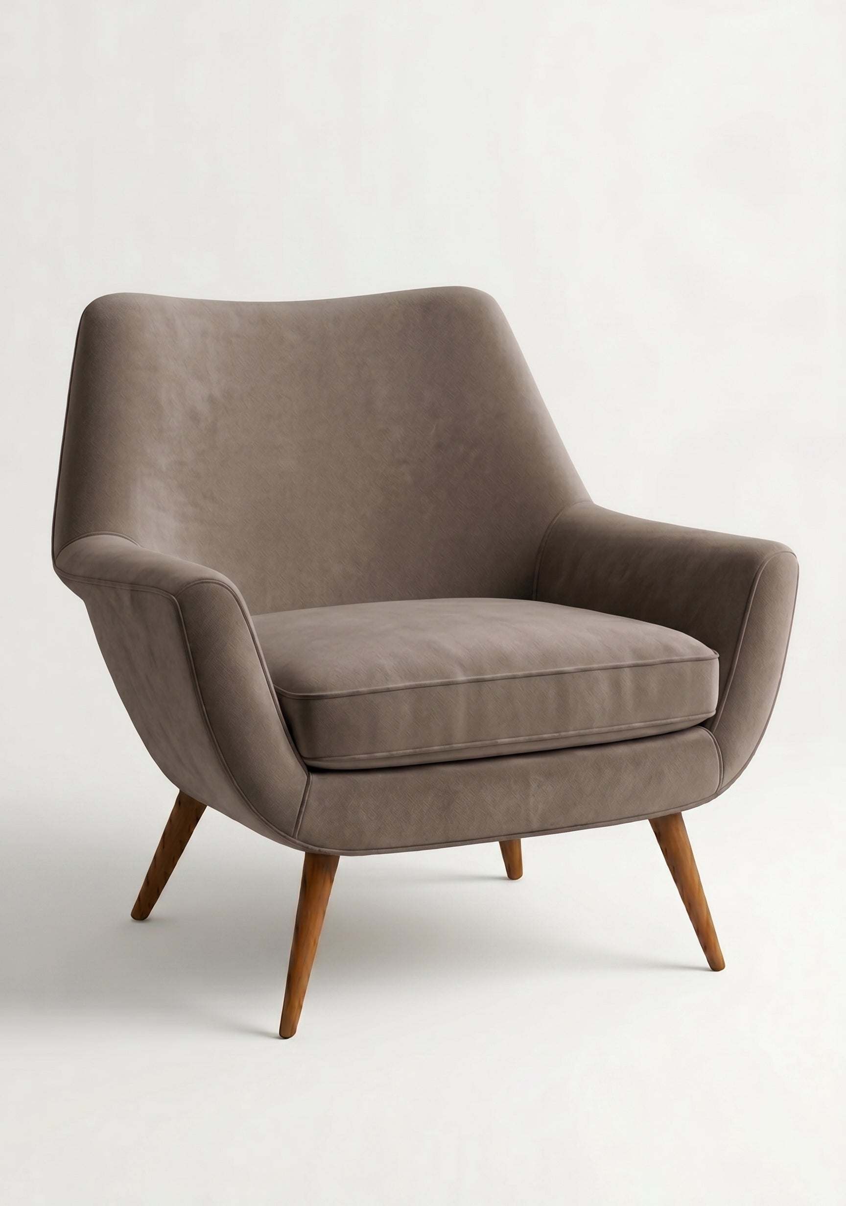 Sillón de un cuerpo Chloe color Visón en pana antimanchas importada, respaldo curvo envolvente y patas de madera inclinadas de aire retro — ideal para sumar onda vintage al living. Hecho a medida por Tienda de Banquitos.