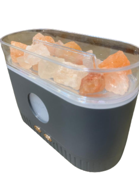Humidificador con piedras de sal visto de costado, con la luz redonda y los botones del frente