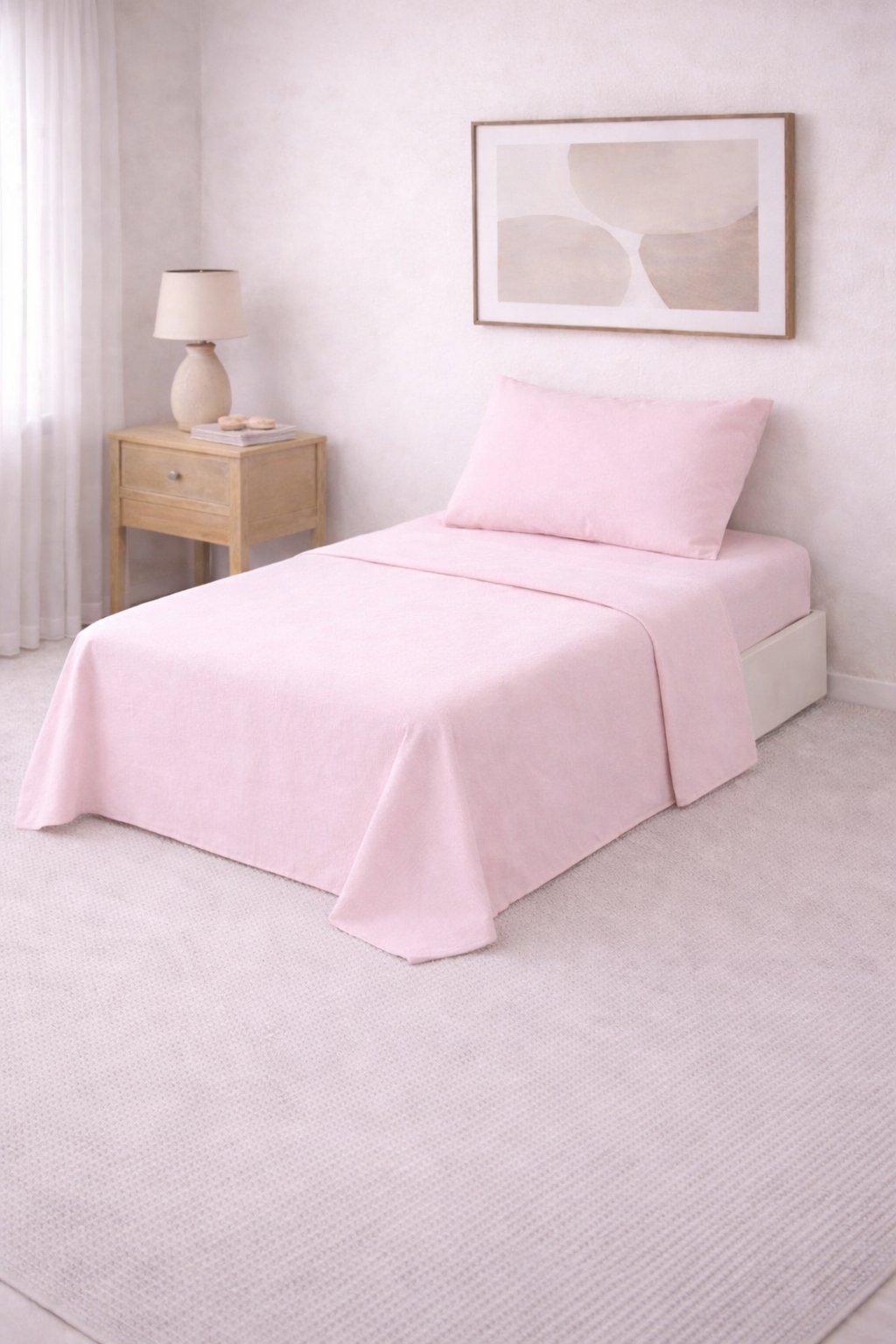 Juego de sábanas lisas Twin rosa bebé con una funda de almohada, tendido en una cama de una plaza