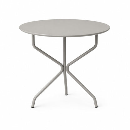 Mesa Cabo redonda fija en color gris, con patas de caño que se cruzan bajo la tapa