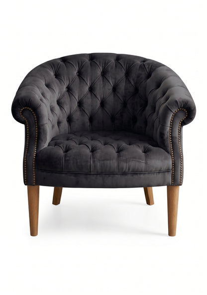 Sillón Nairobi de un cuerpo tapizado en onix, capitoné redondeado con tachas y patas de madera – Tienda de Banquitos