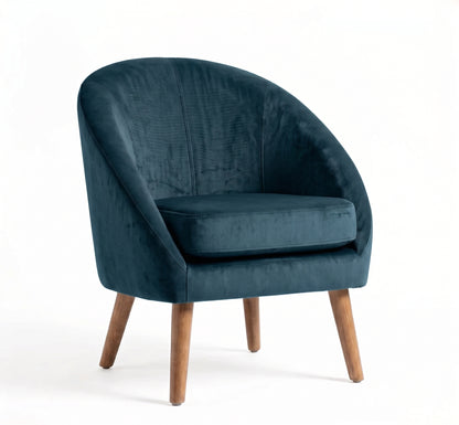 Sillón de un cuerpo Paris color Océano en pana antimanchas importada, forma redonda y compacta con apoyabrazos integrados — que no ocupe mucho lugar en el living. Hecho a medida por Tienda de Banquitos.