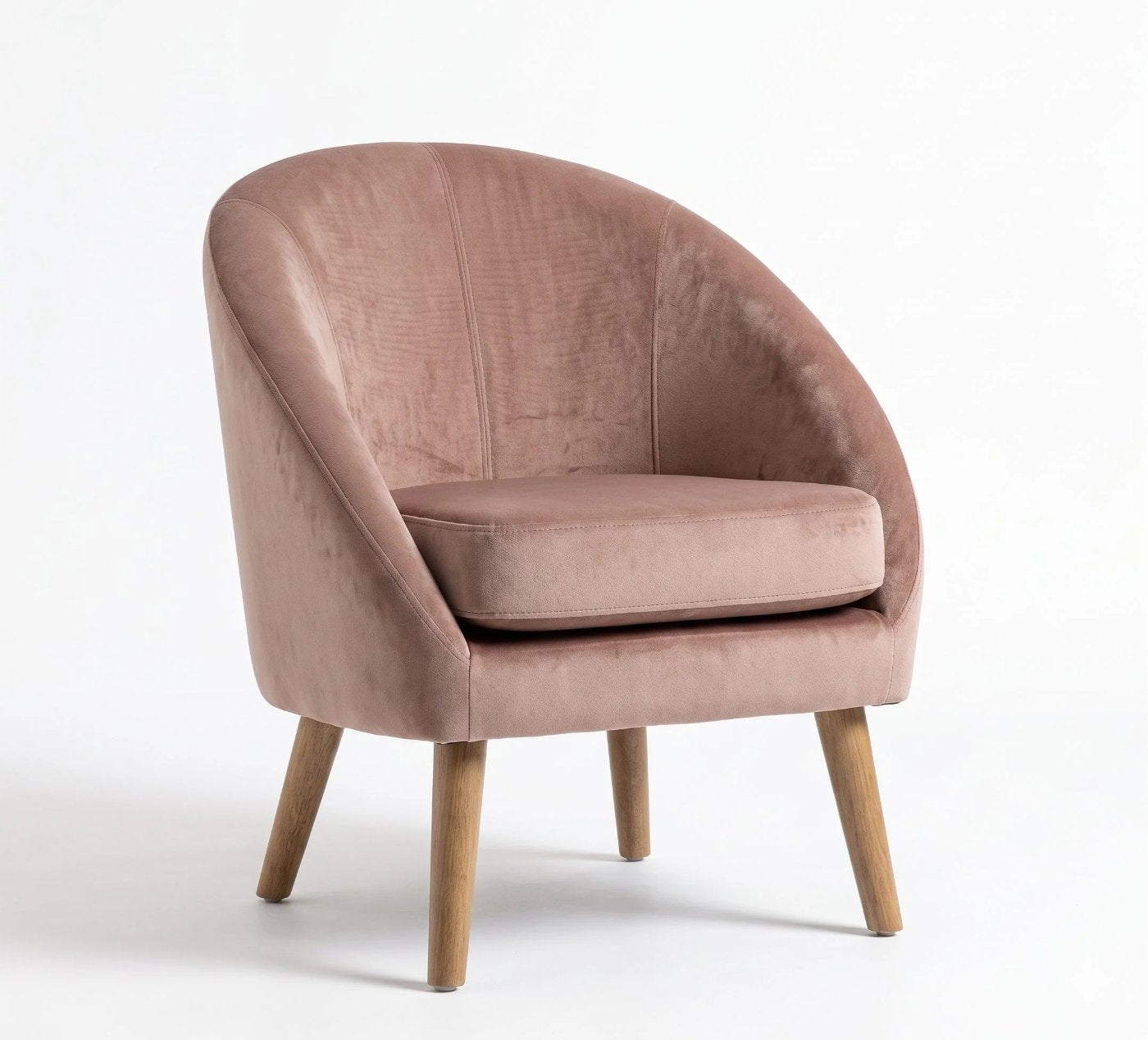 Sillón de un cuerpo Paris color Rosa en pana antimanchas importada, forma redonda y compacta con apoyabrazos integrados — que no ocupe mucho lugar en el living. Hecho a medida por Tienda de Banquitos.