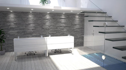 Recepción Zen de Archivos Activos doble y blanca, junto a una pared de piedra