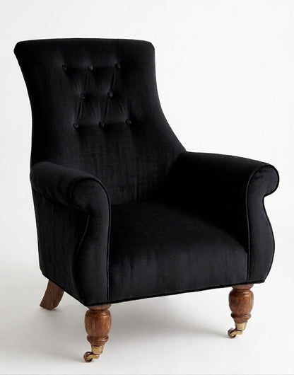 Sillón Astrid de un cuerpo en pana antimanchas Black, respaldo alto con capitoné y patas de madera torneada