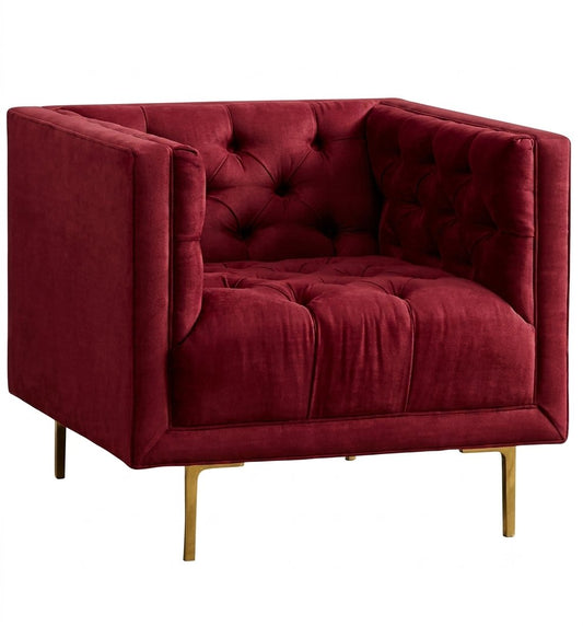 Sillón Bella Donna de un cuerpo tapizado en bordo, forma cúbica con capitoné de botones y patas de metal doradas – Tienda de Banquitos