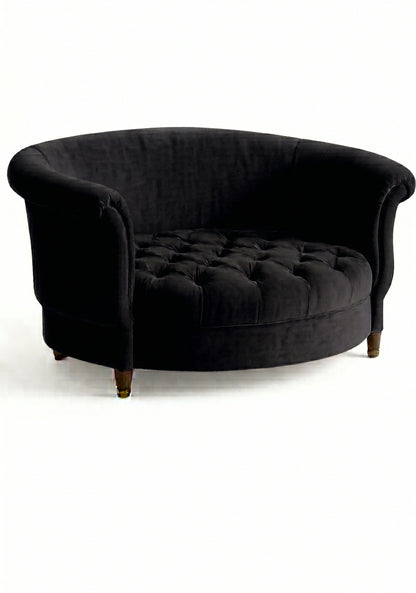 Sillón Brigitte redondo de Tienda de Banquitos tapizado en color black, con respaldo curvo envolvente y asiento capitoné