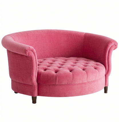 Sillón Brigitte redondo de Tienda de Banquitos tapizado en color chicle, con respaldo curvo envolvente y asiento capitoné