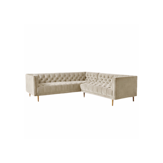 Sillón esquinero Bella Donna en beige con capitoné en respaldo, brazos y asiento, y patas finas de madera