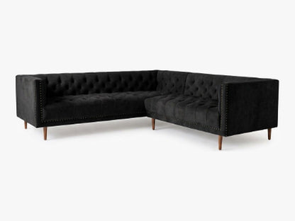 Sillón esquinero Bella Donna en pana antimanchas Black, forma en L, capitoné, borde con tachas y patas de madera