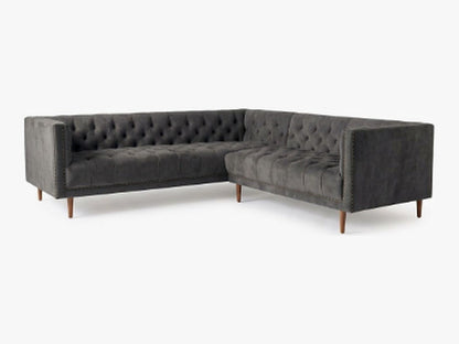 Sillón esquinero Bella Donna en pana antimanchas Grafito, forma en L, capitoné, borde con tachas y patas de madera