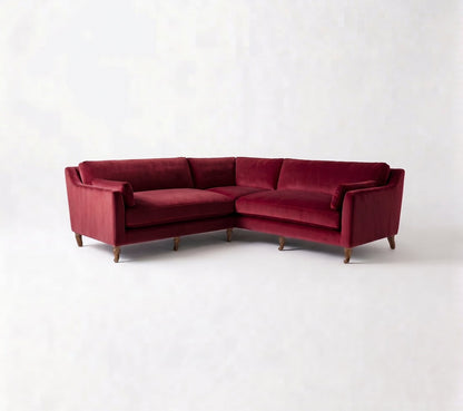 Sillón esquinero Leonelle en pana antimanchas Bordó, forma en L, almohadones y patas torneadas de madera