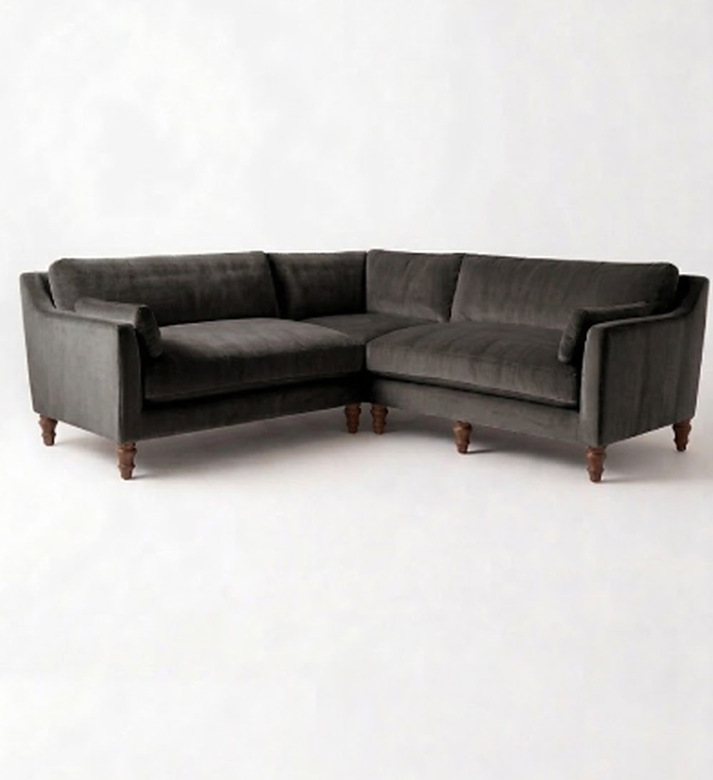 Sillón esquinero Leonelle en pana antimanchas Grafito, forma en L, almohadones y patas torneadas de madera