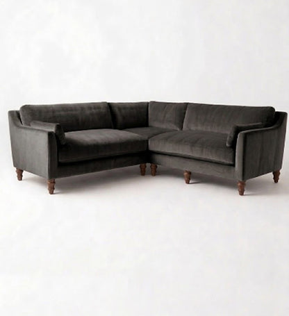 Sillón esquinero Leonelle en pana antimanchas Grafito, forma en L, almohadones y patas torneadas de madera