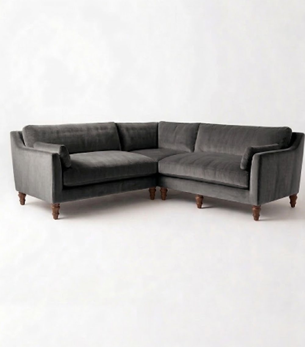 Sillón esquinero Leonelle en pana antimanchas Onyx, forma en L, almohadones y patas torneadas de madera