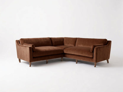 Sillón esquinero Leonelle en pana antimanchas Suela, forma en L, almohadones y patas torneadas de madera