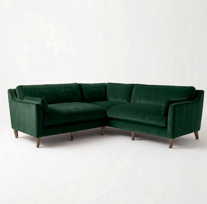 Sillón esquinero Leonelle en pana antimanchas Verde inglés, forma en L, almohadones y patas torneadas de madera