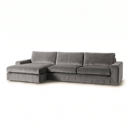 Sillón esquinero Victoria en pana antimanchas color Onyx, forma en L con chaise, brazos rectos y almohadones grandes