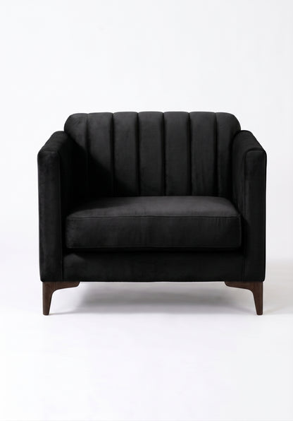 Sillón de un cuerpo Mila color Grafito en pana antimanchas importada, líneas rectas y diseño moderno con patas doradas — el detalle distinto para un living contemporáneo. Hecho a medida por Tienda de Banquitos.