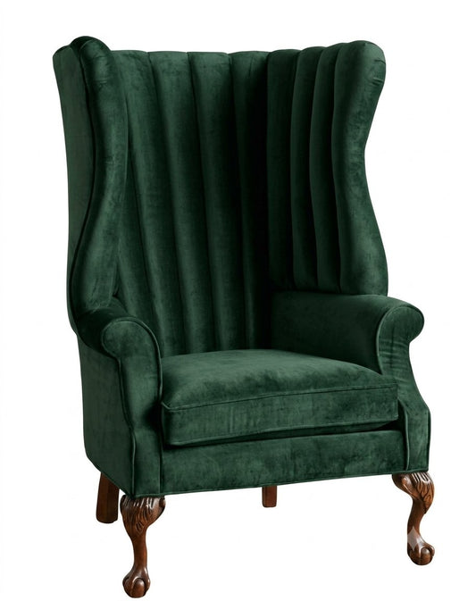 Sillón Mortisia de un cuerpo tapizado en verde, respaldo alto acanalado tipo orejero y patas de madera con garras – Tienda de Banquitos