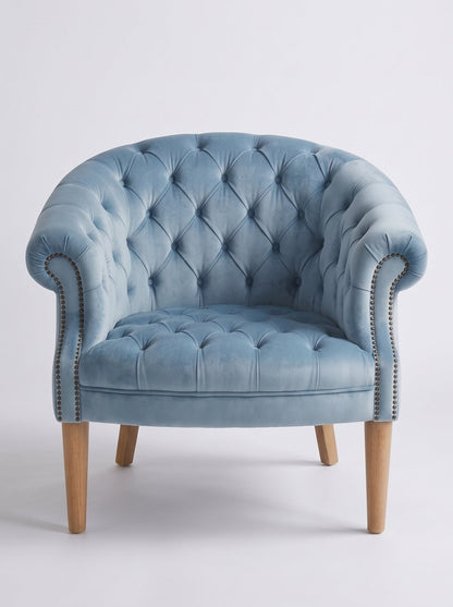 Sillón Nairobi de un cuerpo en pana antimanchas Océano, capitoné redondeado con tachas y patas de madera