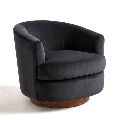 Sillón Rosaura de un cuerpo, forma redondeada y compacta, tapizado en pana antimanchas color Grafito