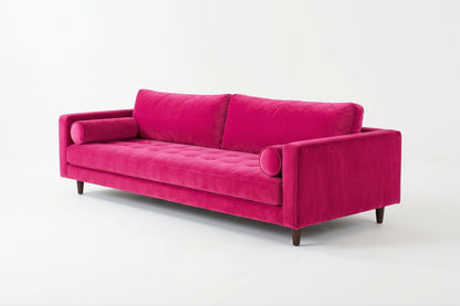 Sofá Bambú con botoné en el asiento y almohadones cilíndricos, en pana antimanchas color chicle, imagen ilustrativa - Tienda de Banquitos