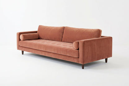 Sofá Bambú con botoné en el asiento y almohadones cilíndricos, en pana antimanchas color rosa, imagen ilustrativa - Tienda de Banquitos