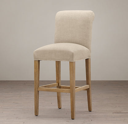 Banqueta Alta Caléndula en color beige con patas de madera natural