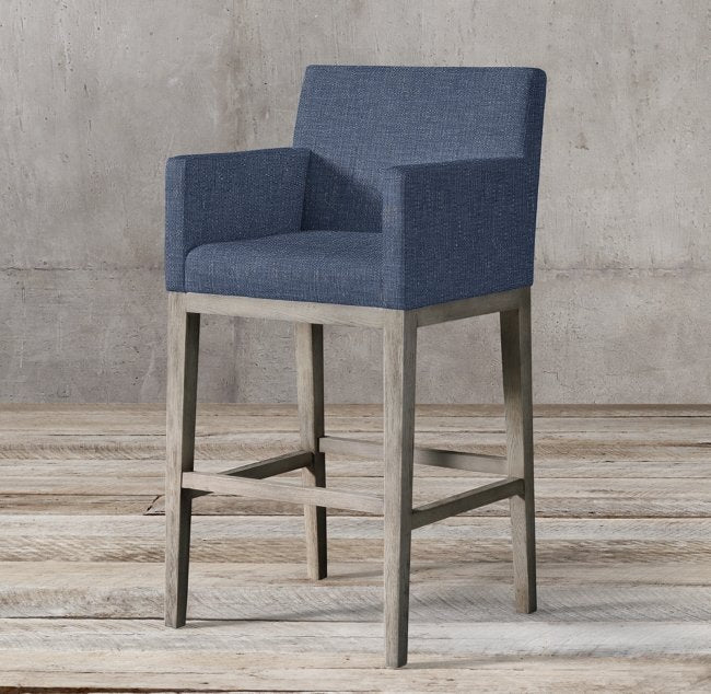 Banqueta Alta Valentina en azul con apoyabrazos rectos y patas de madera gris