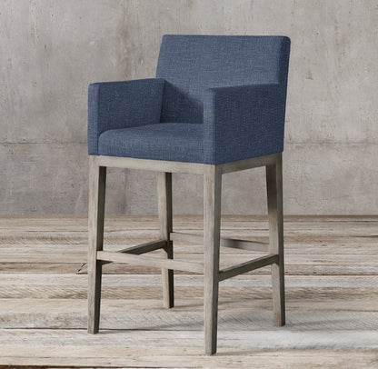 Banqueta Alta Valentina en azul con apoyabrazos rectos y patas de madera gris