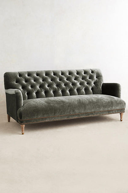 Sillón de tres cuerpos con capitoné gris oscuro 