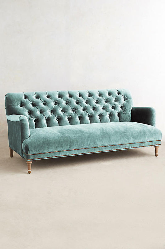 Sillón de tres cuerpos con capitoné color verde agua 